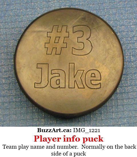 Team play name and number.  Normally on the back side of a puck